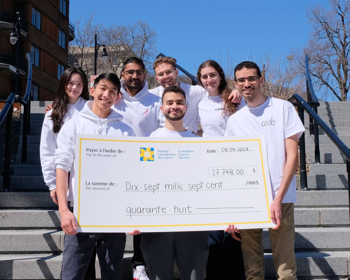 A few of our directors holding a giant cheque