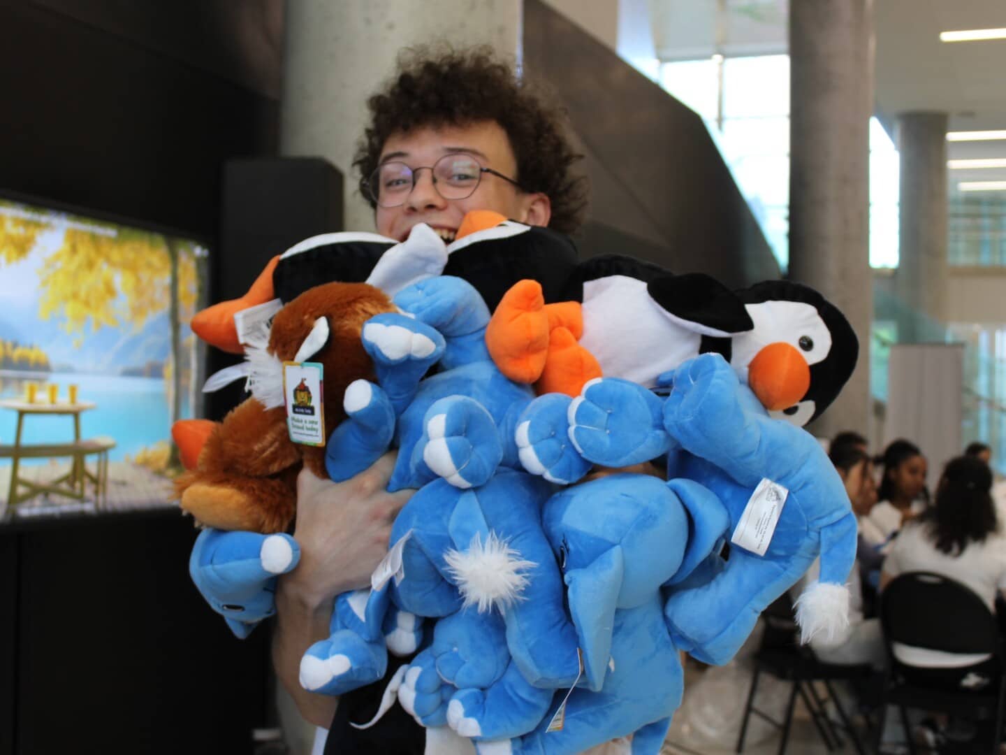 One of our members holding multiple plushies during our Christmas in July event