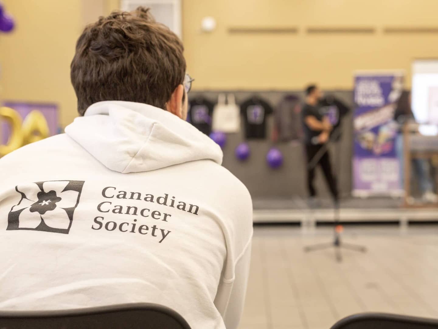 One of our members wearing a Coda hoodie at our 2023 World Cancer Day event